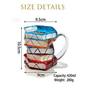May include: A colorful glass mug shaped like a stack of books. The mug is 10.5 cm tall, 9.5 cm wide, and 9 cm deep. It has a capacity of 420ml and weighs 280g. The mug features blue, orange, and red book spines. The handle is clear glass.