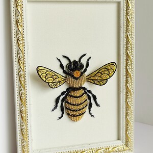 Forestcore decor artwork featuring a luxury hand-embroidered queen bee in a light-colored wooden frame.