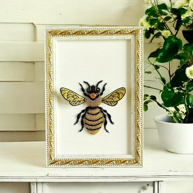 Delicate beaded bee design used as wall hanging decor for cozy homes