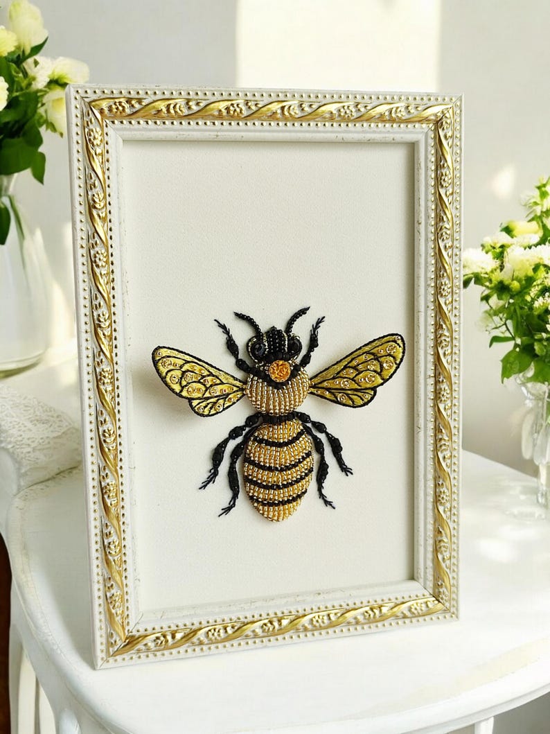 Ethical taxidermy display containing a handcrafted beaded insect