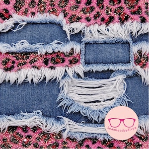 May include: Close-up of distressed denim fabric with pink leopard print accents. The denim is a medium blue with frayed edges and ripped details. The leopard print has a glittery finish, adding a touch of sparkle to the design. The overall aesthetic is edgy and fashionable.