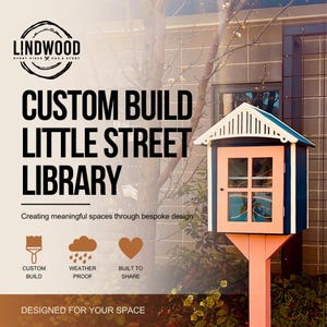 May include: A custom build little street library with a dark blue exterior, white trim, and a light pink door featuring a glass window. The structure has a peaked roof and stands on a single post. Text includes LINDWOOD, CUSTOM BUILD LITTLE STREET LIBRARY, Creating meaningful spaces through bespoke design, CUSTOM BUILD, WEATHER PROOF, BUILT TO SHARE, and DESIGNED FOR YOUR SPACE.