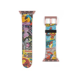 May include: A rose gold Apple Watch band with a comic book print featuring Spider-Man, Iron Man, and other Marvel characters. The band is made of leather and has a rose gold buckle.