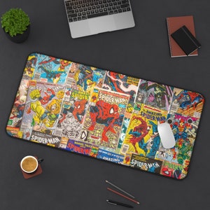 May include: A colorful mousepad featuring a collage of vintage comic book covers featuring Spider-Man. The covers are in various shades of red, blue, yellow, green, and black. The mousepad has a black border.