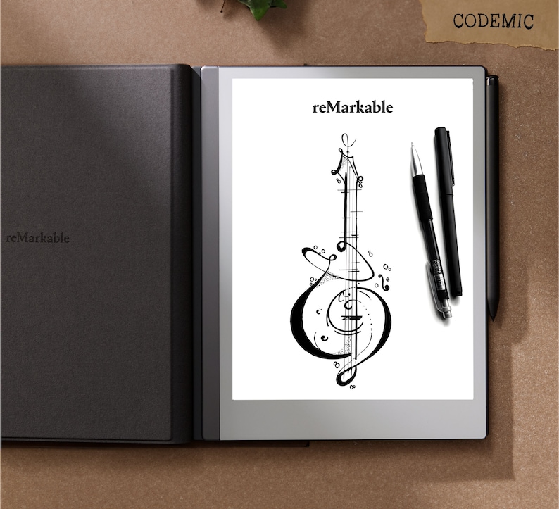 Puede incluir: Tableta reMarkable en blanco y negro con una cubierta negra. La pantalla muestra un dise&ntilde;o de instrumento musical y la palabra "reMarkable". Dos bol&iacute;grafos negros est&aacute;n colocados a la derecha de la tableta.