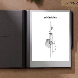 Puede incluir: Un lector electr&oacute;nico negro con la palabra "reMarkable" impresa en la cubierta y la pantalla. La pantalla muestra una ilustraci&oacute;n de guitarra en blanco y negro. Un l&aacute;piz &oacute;ptico negro est&aacute; adjunto. El lector electr&oacute;nico est&aacute; abierto, revelando la pantalla.
