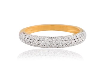 May include: A gold band ring with a triple row of small diamonds.