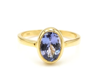 Anillo de oro amarillo de 14 quilates con tanzanita natural de talla ovalada: Joyería con la piedra natal de diciembre