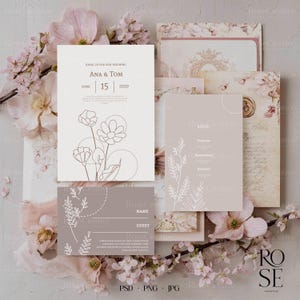 May include: A collection of wedding stationery, including invitations, menus, and RSVP cards. The designs feature floral line art and the names "Ana & Tom" with the date "June 15, 2020". Soft pink and beige tones are used throughout the set.