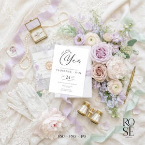 May include: A wedding invitation with the words "She Said Yes" in elegant script, surrounded by flowers, a ring box, gloves, and vintage opera glasses. The invitation includes the names Florence and Sam, and the date July 24.