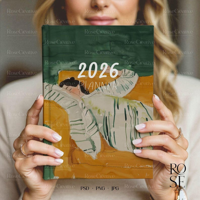 A lifestyle photograph of a woman softly smiling while holding a blank, cream-colored A5 hardcover book directly in front of her. She is holding the book with both hands, showcasing a delicate rose gold watch and rings. The lighting is soft and natural, creating a feminine, high-end aesthetic.