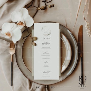 Puede incluir: Una plantilla de menú de boda con un diseño simple y elegante. El menú está impreso en cartulina blanca y presenta una fuente manuscrita. El menú incluye los nombres "Emily & Luca" y los encabezados "El Menú", "Aperitivos", "Entrantes", "Acompañamientos" y "Postre".