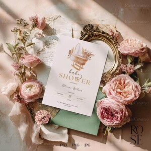 Romantic fine art wedding mockup flatlay with pink roses, vintage golden frame, green envelope and sunlight — elegant floral scene for stationery designs.