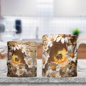 May include: Two white ceramic mugs featuring a design of a beehive surrounded by white daisies. The beehive is crafted from wood and has a hole in the centre. A bee is flying out of the hole. The mugs are on a light brown surface.