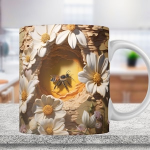 May include: White ceramic mug with a 3D design of a bee flying into a flower nest. The design features white flowers with yellow centers and a brown, textured background.