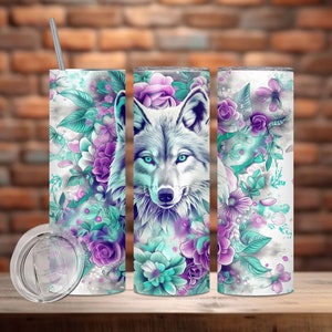 May include: A white wolf with blue eyes is surrounded by purple and teal flowers on a white background. The image is on a stainless steel tumbler with a lid.