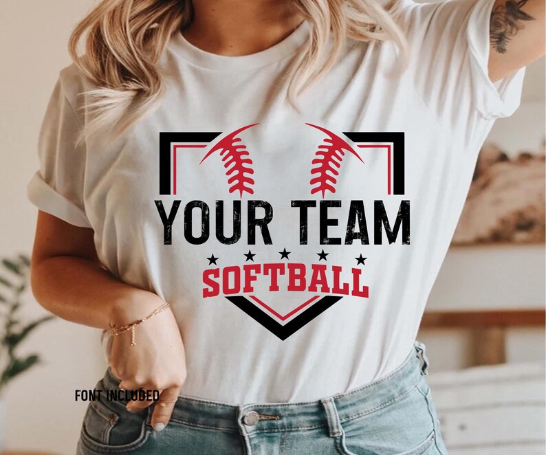 May include: White t-shirt with a black and white baseball diamond graphic. The graphic includes red stitching, two red baseballs, and the text "Your Team Softball".