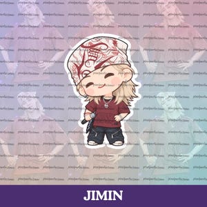May include: A sticker featuring a chibi-style illustration of a person with blonde hair wearing a white patterned bandana, a maroon t-shirt, and dark pants with silver zippers. The character holds a microphone and wears a silver cross necklace.