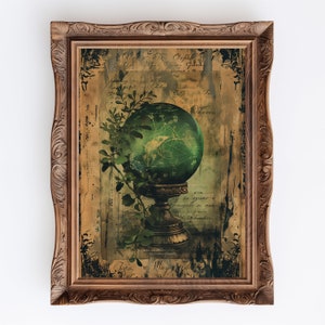 May include: A vintage-style framed print featuring a green glass orb on a pedestal, surrounded by a leafy vine. The background is a collage of old paper with handwritten text and faded imagery.