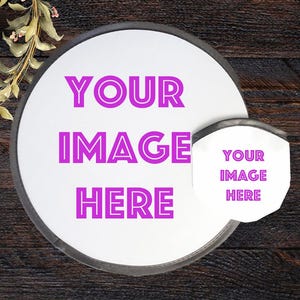May include: A white, circular product with the text "YOUR IMAGE HERE" in bright pink. A smaller, matching product is attached. The background is a dark wood grain.
