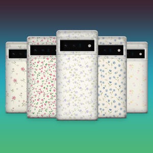 May include: Five phone cases with floral patterns. The cases have a white background with pink, purple, and blue flowers. The cases are arranged in a row, showcasing the different floral designs.