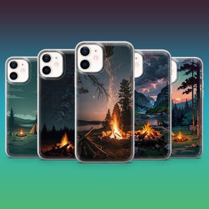 May include: Five phone cases with camping-themed designs. Each case shows a different outdoor scene, such as campfires, tents, and mountain landscapes. The cases have a clear border and a glossy finish, highlighting the colourful artwork.