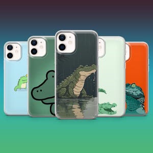 May include: Five different phone cases with a crocodile design. The cases are clear and show the phone's design. The crocodiles are green and have a cartoonish style.