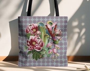 May include: A tote bag with a floral design featuring pink flowers, green leaves, and a hummingbird. The bag has a black handle and a light blue background with a repeating pattern of purple and gold circles.