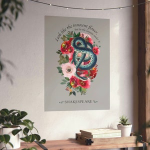 May include: A watercolour illustration of a snake curled up in a bouquet of red, pink and white flowers. The text "Look like the innocent flower, but be the serpent under it." is written above the snake and flowers. The text "SHAKESPEARE" is written below the snake and flowers.