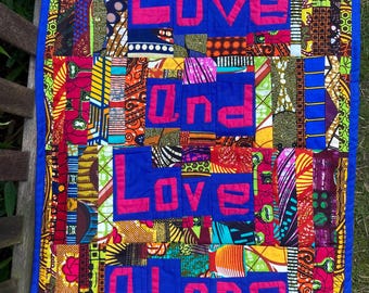 Ankara word patchwork wall hanging African wax textile art ‘Love and love slone’