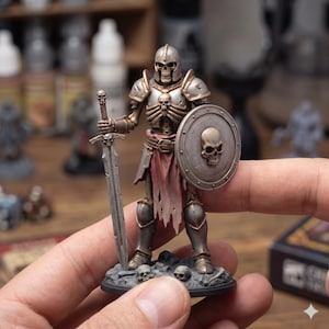 May include: A miniature skeleton warrior figurine, clad in metallic armor and holding a sword and shield. The shield and armor feature skull motifs. The figure stands on a base with small skulls, and a tattered red cloth hangs from the waist. The overall color scheme is silver, bronze, and red.