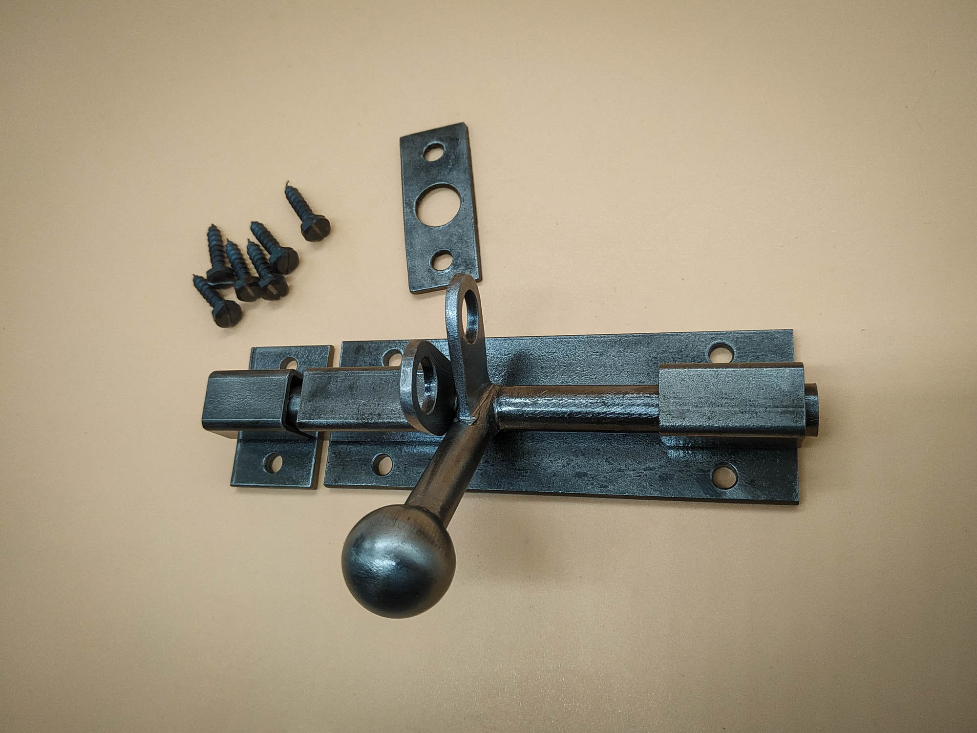 An Industrial Door Latch, Handcrafted From Steel in a Rustic Style
