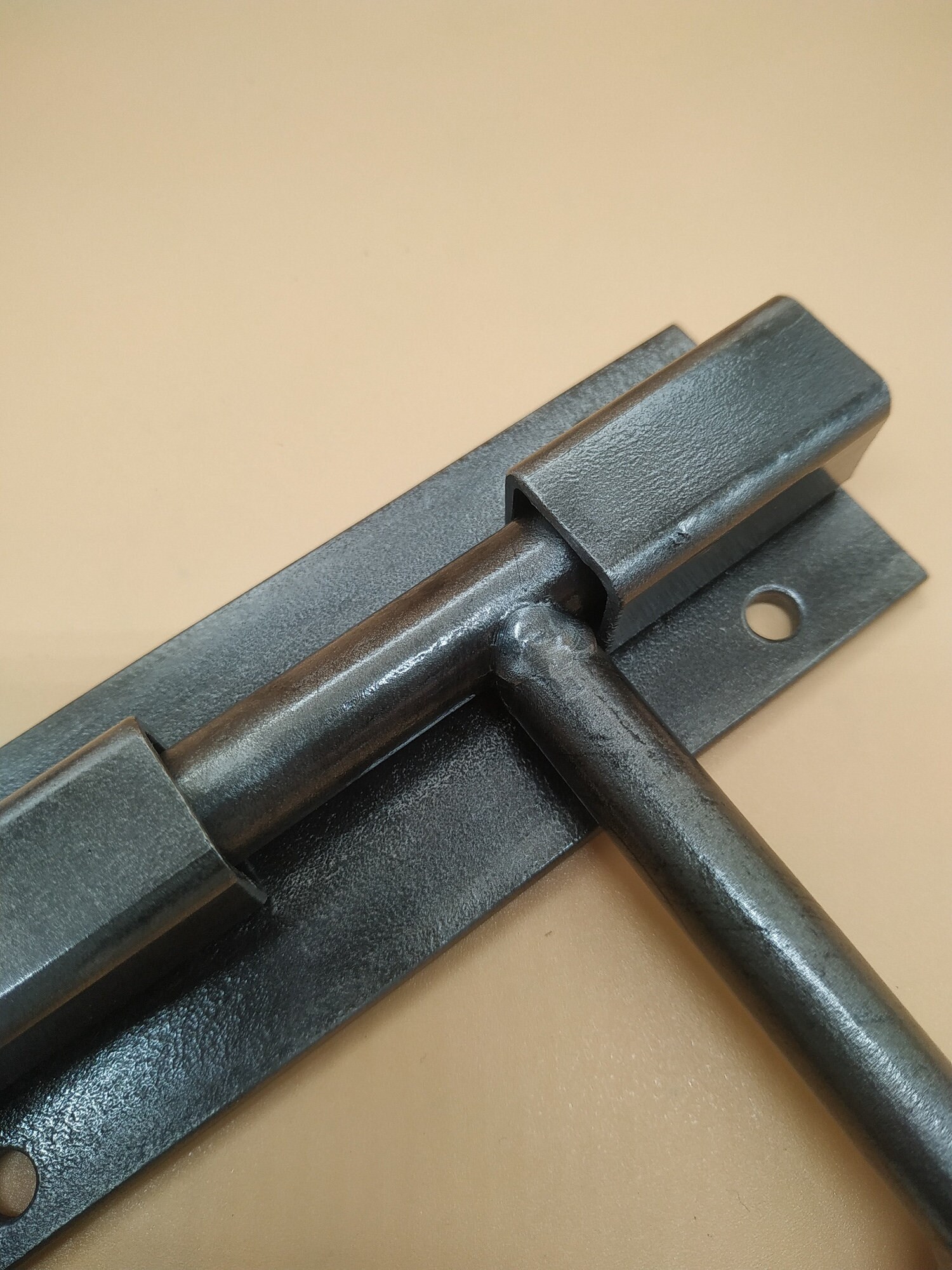 An Industrial Door Latch, Made From Steel in a Rural Style, Ensures