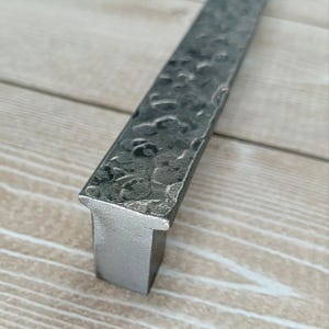 Rustic wrought iron handles with textured finish — hand-forged industrial hardware for drawers, cabinets, and kitchen furniture