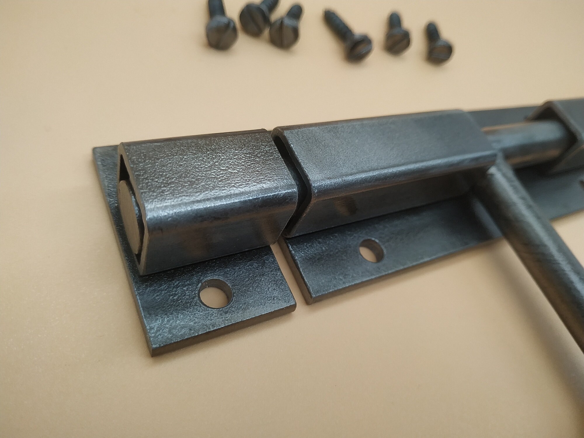 An Industrial Door Latch, Made From Steel in a Rural Style, Ensures