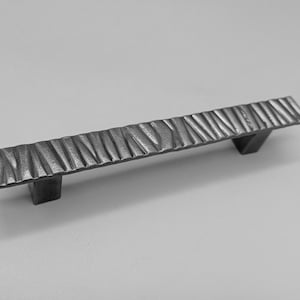 Unique handcrafted handles with distinctive textures that bring stylish charm to your furniture.