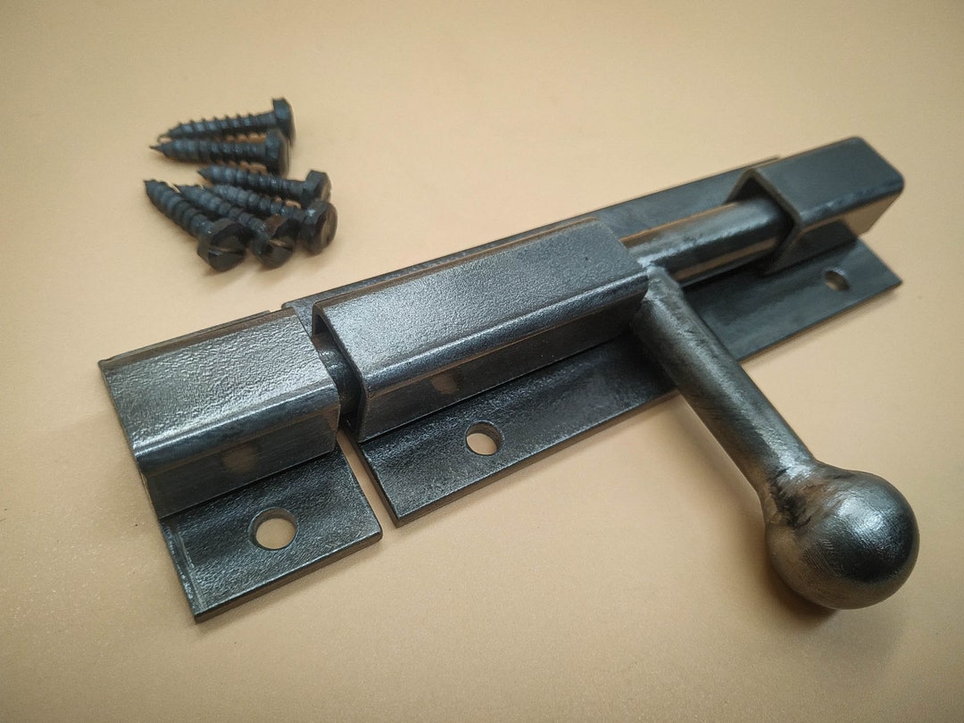 An Industrial Door Latch, Made From Steel in a Rural Style, Ensures