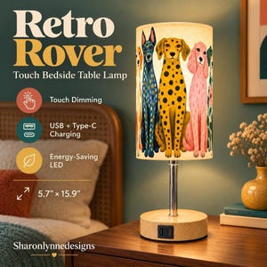 May include: A cylindrical bedside table lamp with a light wood base and a chrome stem. The lampshade features a colorful illustration of five dogs. The base includes a USB and Type-C charging port. Text on the image reads Retro Rover Touch Bedside Table Lamp, Touch Dimming, USB + Type-C Charging, Energy-Saving LED, 5.7" x 15.9", and Sharonlynnedesigns.