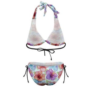 A floral halter bikini top and matching tie-side bottom are displayed flat against a white background.