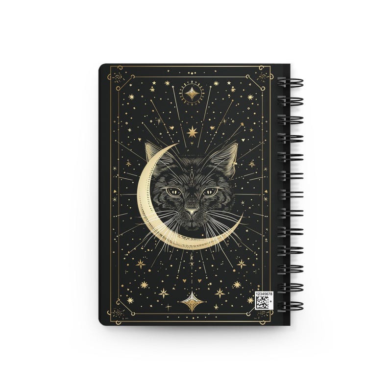 Back cover of the black and gold celestial cat spiral notebook with a barcode in the bottom right corner.