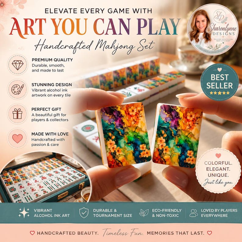 May include: A handcrafted Mahjong set featuring tiles with vibrant, multi-colored alcohol ink floral artwork. The set includes a storage case filled with tiles, and two individual tiles are displayed showing detailed orange, purple, and teal patterns.