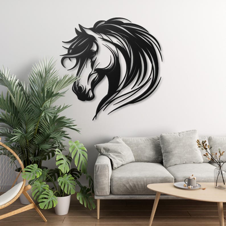 May include: Black metal wall art featuring a horse's head with flowing mane. The horse is facing left and has a detailed design.