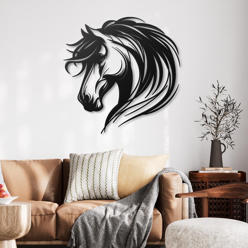 May include: Black metal wall art featuring a horse's head in profile. The horse has a flowing mane and tail. The art is mounted on a white wall in a living room setting.