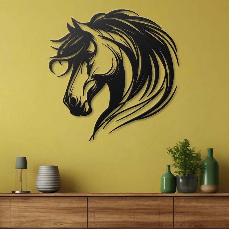 May include: Black metal wall art featuring a horse's head with flowing mane. The horse is facing left and has a stylized design. The art is mounted on a yellow wall above a wooden shelf with decorative items.