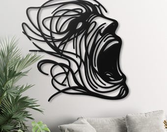 Arte mural de metal con rostro gritando, expresión emocional abstracta,