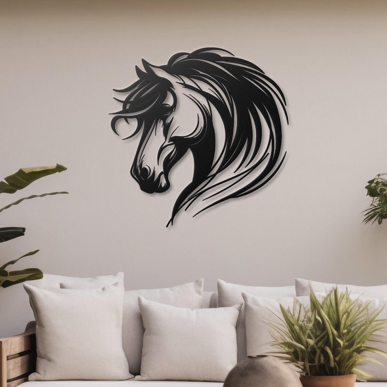 May include: Black metal wall art featuring a horse's head with flowing mane. The horse is facing left and has a detailed design.