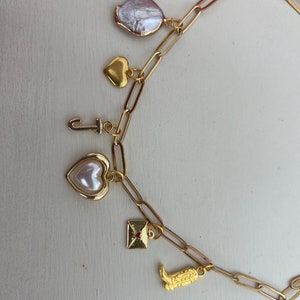 Suprise Gold Charm Necklace! Want a charm necklace but can’t decide which charms to get? Get a surprise charm necklace!