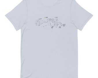 May include: A light blue t-shirt with a black and white illustration of a ski resort map. The map shows the different runs and lifts at the resort. The text on the map includes "The Mountain" and "Ski Area".