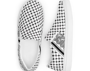 May include: A pair of white canvas slip-on shoes with a black and white geometric pattern. The pattern is a traditional Palestinian keffiyeh design.