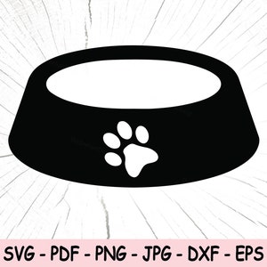 Puede incluir: Silueta en blanco y negro de un cuenco para perros con una huella de pata en el centro.